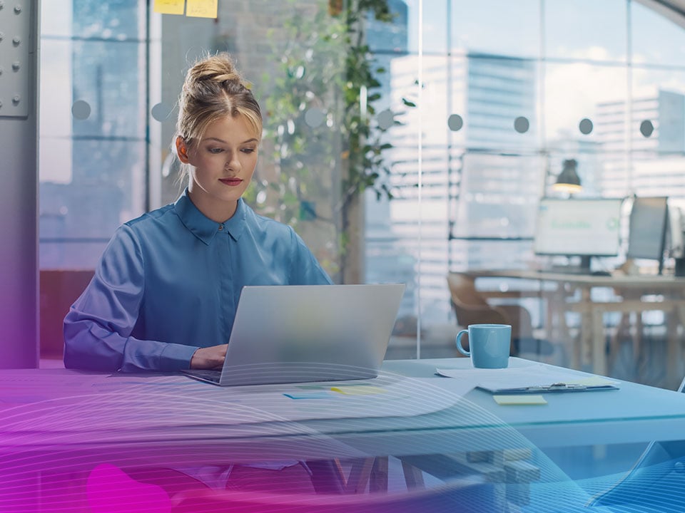 Portrait-of-a-Smiling-White-Female-Working-on-a-Creative-Job-Position-in-an-Advertising-Company-Using-Laptop-Computer--1